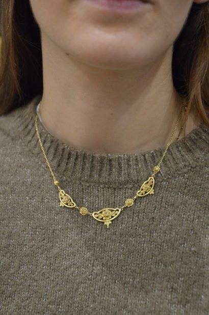 Collier
En or jaune 18K 750/°° à décor de...