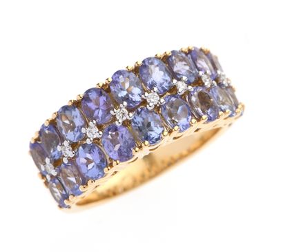Bague jonc 
en or jaune 18k 750°/°° ornée...