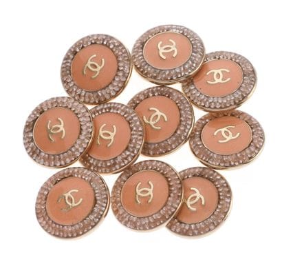 CHANEL
Set of ten coral enamel buttons embellished...