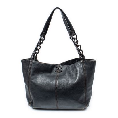 CHANEL
Black grained leather shopping bag...