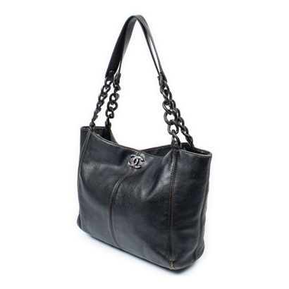 CHANEL
Black grained leather shopping bag...