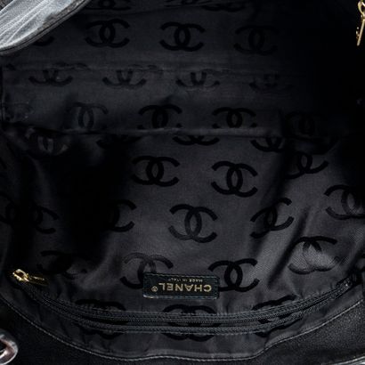 CHANEL
Black grained leather shopping bag...