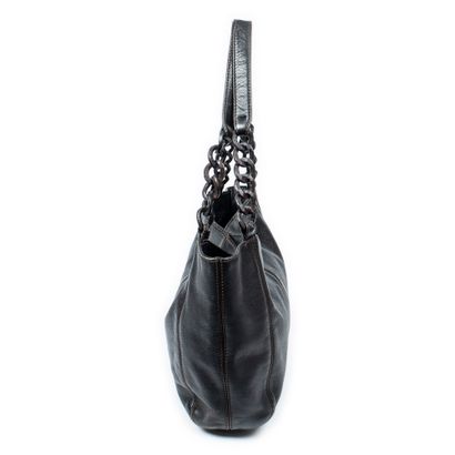 CHANEL
Black grained leather shopping bag...