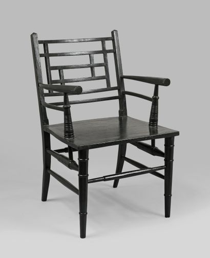 20th century work
Black lacquered wood armchair...