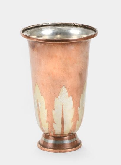 CHRISTOFLE
A flared brassware vase with geometric...