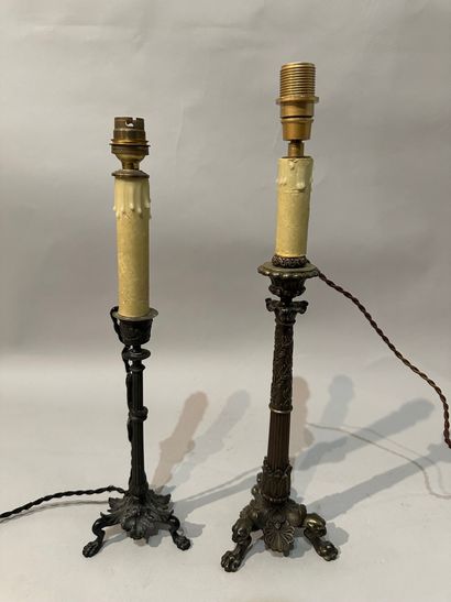 A tripod FLAMBEAU in brown patina bronze...