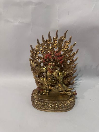 TIBET - Gilt bronze and red patina SUBJECT...