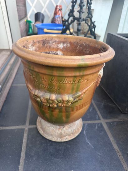 Two large celadon earthenware CACHE-POTS....