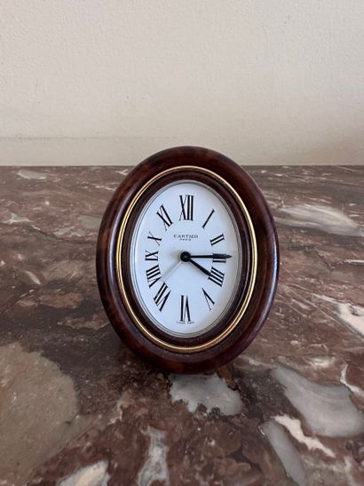 CARTIER - Oval gilt metal PENDULET with imitation...