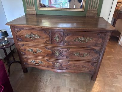 A fruitwood COMMODE with a curved front,...