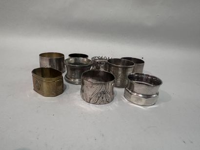 Set of nine silver and metal napkin rings....