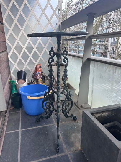 Wrought-iron bistro table, veined white marble...
