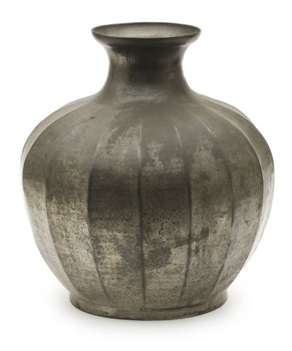 A E CHANAL
Vase with gadrooned body in hammered...