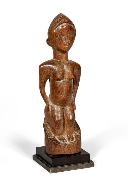 Anthorpomorphic statuette in carved wood....