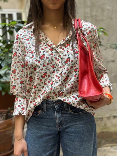 NINA RICCI
Blouse blanche en soie à motifs...