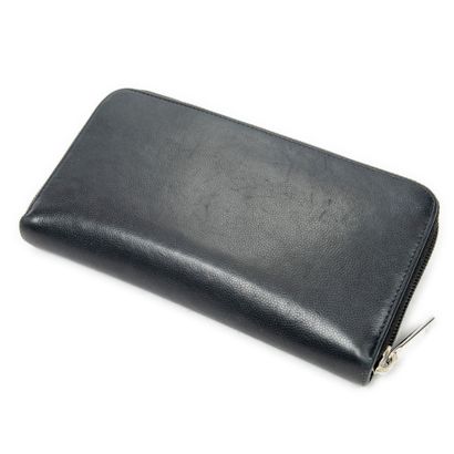 CHANEL
Portefeuille en cuir de veau noir,...