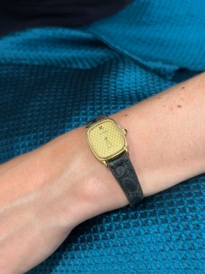 COURREGES 
Gilt steel ladies' watch, tonneau-shaped...