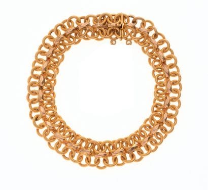 Bracelet
en or jaune 18K 750/°° à mailles...