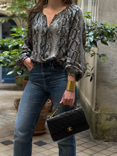 TOM FORD
Blouse en soie motif python.
Taille...