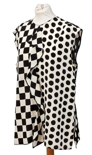 LOUIS VUITTON
Blouse en soie à pois blanc...