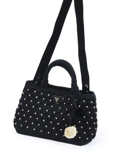 PRADA
Sac à main fourre-tout en raffia noir...