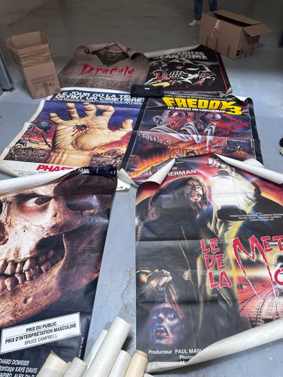 A set of horror movie posters including:...