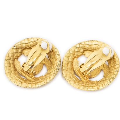 CHANEL
Pair of round gold-tone metal clip-on...
