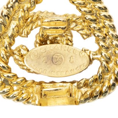 CHANEL 
Pair of gold-tone metal clip-on earrings...