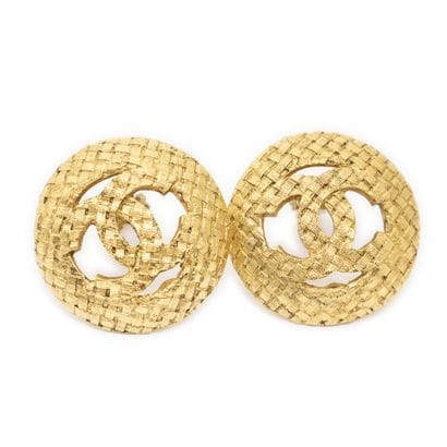 CHANEL
Pair of round gold-tone metal clip-on...