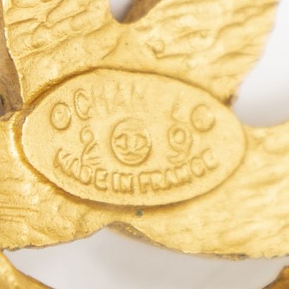 CHANEL
Pair of round gold-tone metal clip-on...