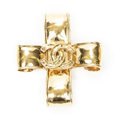CHANEL
Gold-tone metal cross brooch with...