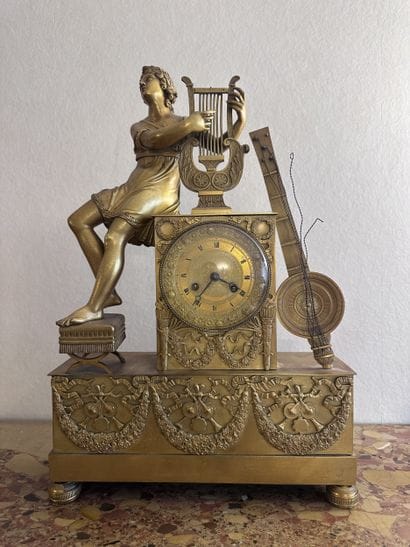 Gilded bronze clock; the movement is housed...