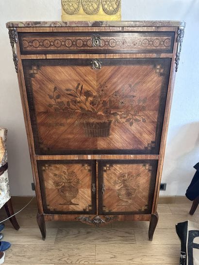 A secretary desk made of wood veneer and...