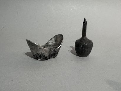 CHINA
Two small metal ORNAMENTS, including...