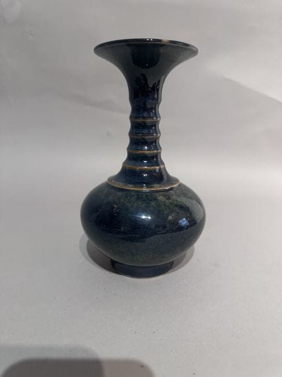 CHINA
Black-glazed ceramic baluster vase....