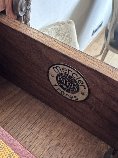 A secretary desk made of wood veneer and...