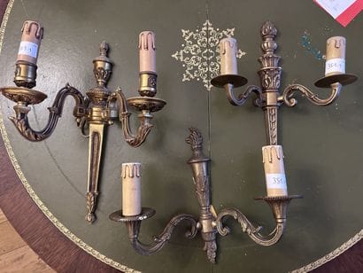 Set of three mismatched gilded bronze wall...