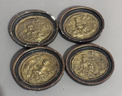 Set of four gilded bronze MEDALLIONS decorated...
