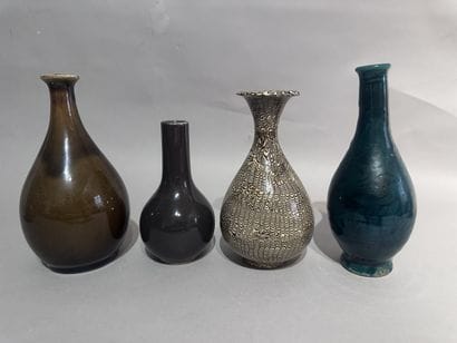 CHINA 
Set of four baluster vases in various...