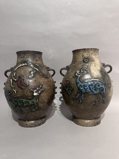 CHINA
Pair of metal baluster vases with a...