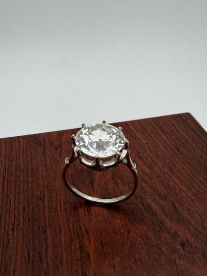 Platinum ring,
set with a round old-cut diamond...