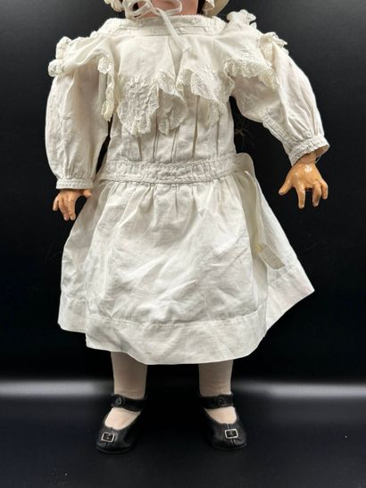 BSW GERMANY.
Porcelain head doll, fixed eyes,...