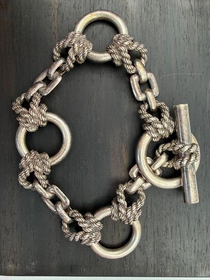 Silver bracelet,
articulated with rings joined...
