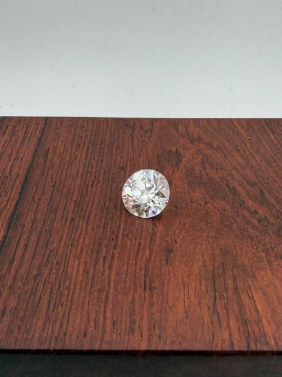 Platinum ring,
set with a round old-cut diamond...
