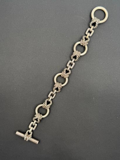Silver bracelet,
articulated with rings joined...