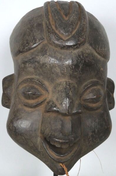 CAMEROON - KOM people

Crest mask representing...