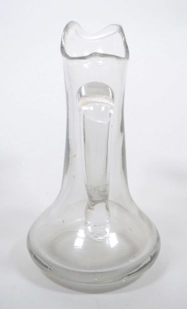 Ensemble en verre comprenant :
- Une bouteille...