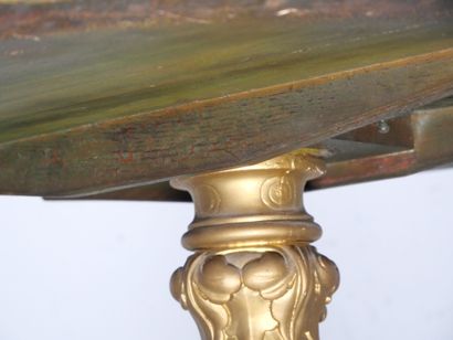 Gilded wood pedestal table carved with scrolls...