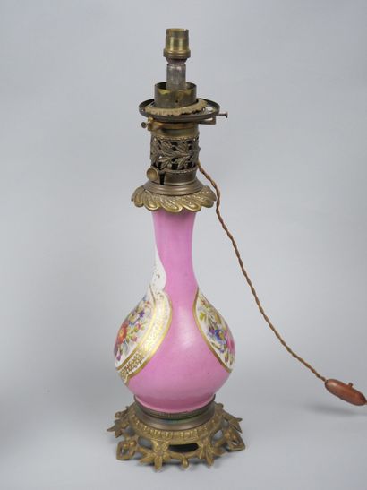 Pair of porcelain oil lamps with polychrome...