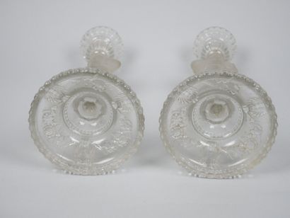 A pair of candlesticks in partially frosted...